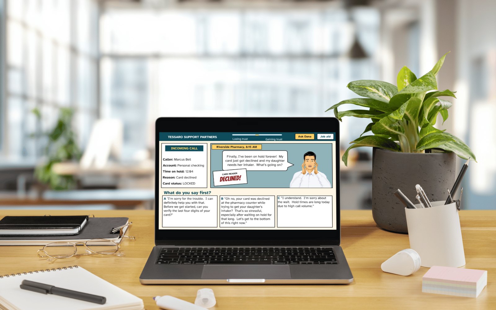 A laptop on a desk showing a decision screen from the course: Marcus Bell calls from a pharmacy after his card was declined, and the learner chooses how to respond.